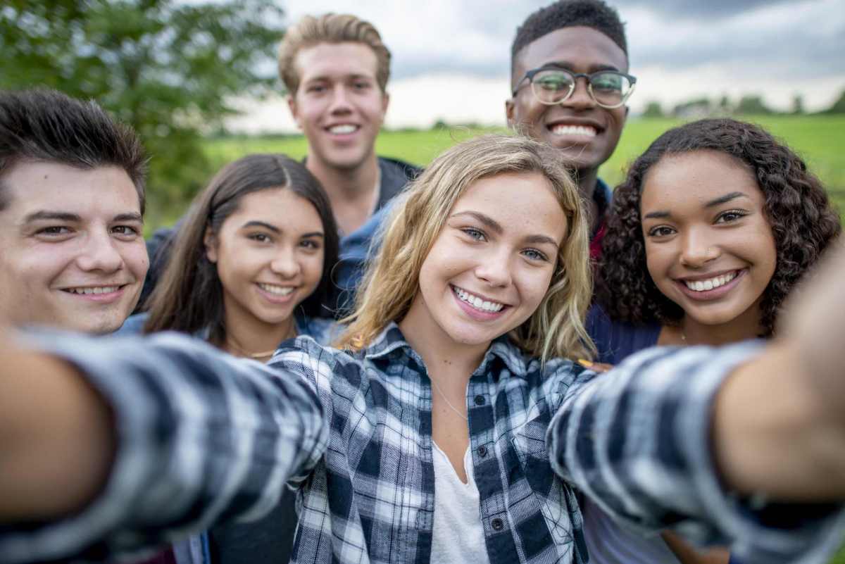 Multi_ethnic Teenagers Taking a Self Portrait stock photo